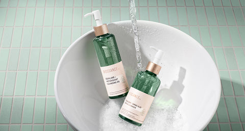 An Oil cleanser and water based cleanser to complete your double cleansing routine in a sink.