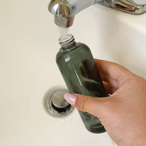 How to easily upcycle a glass bottle into a chick DIY flower vase, rinse inside with soapy water
